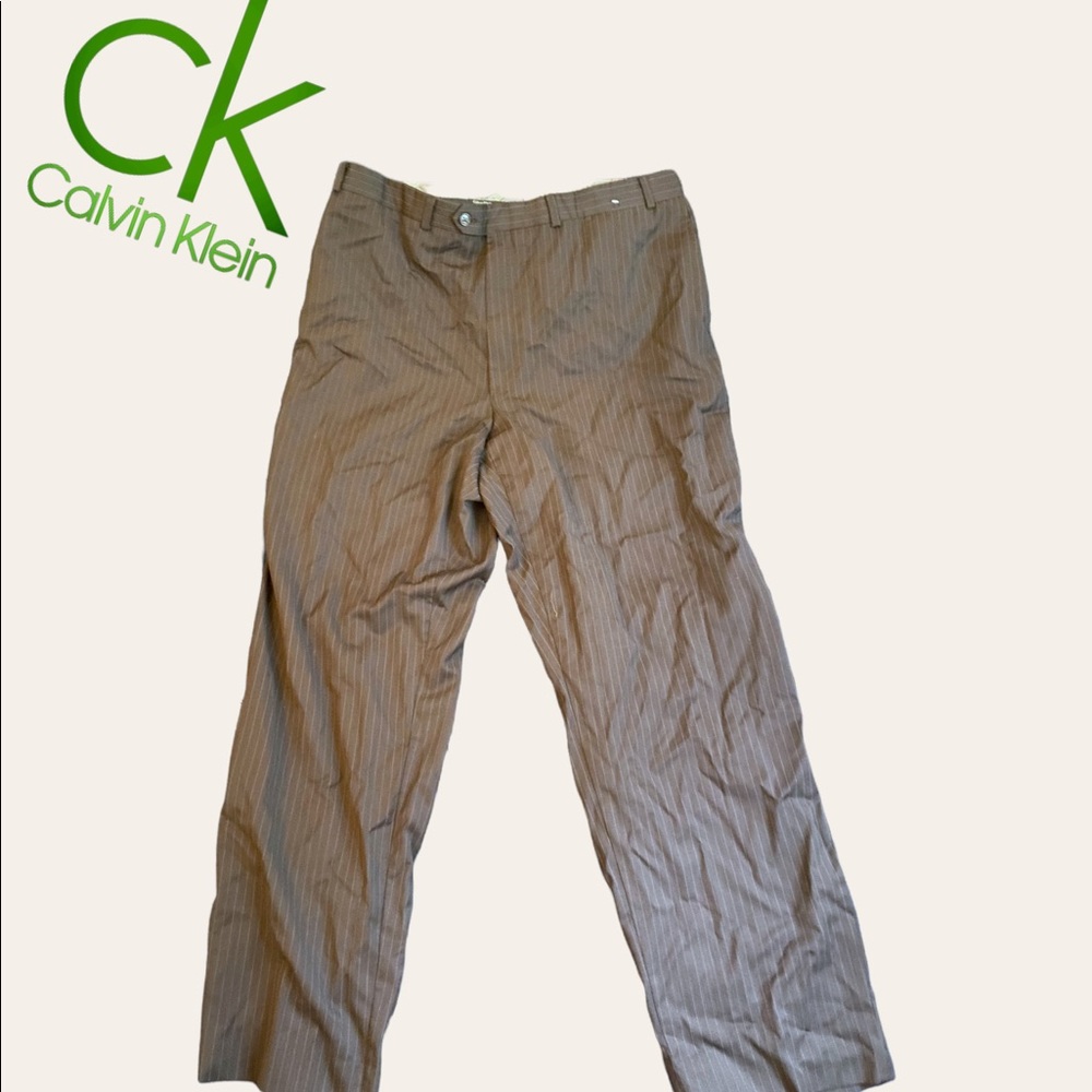 Calvin Klein Brown Pinstripe Pants. Small rip in the pocket
Length: 31.5”